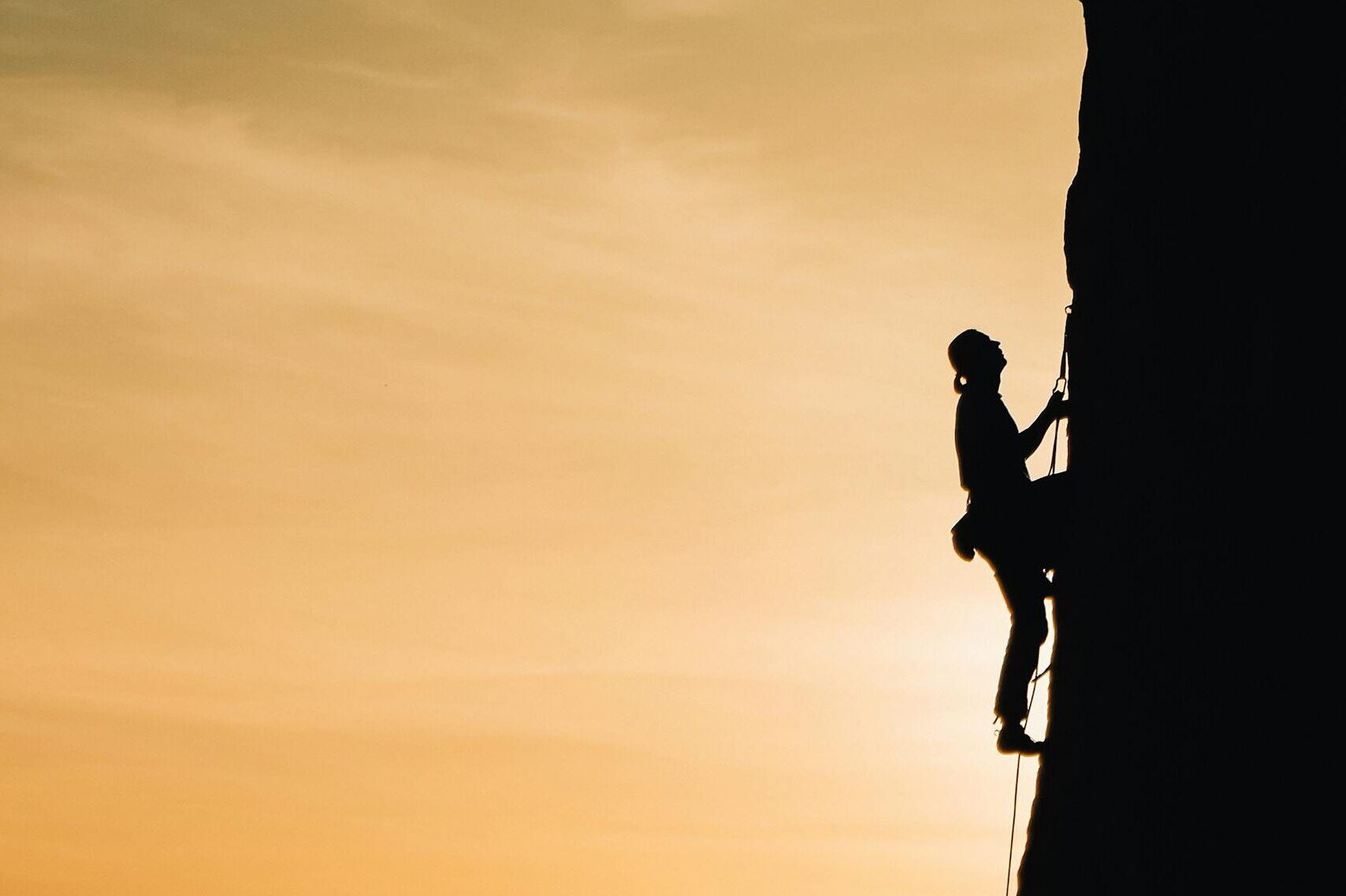 Person Rock Climbing
